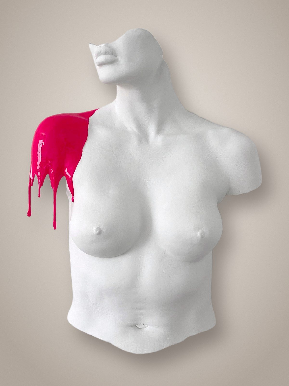 White plaster torso sculpture with hot pink paint dripping from the shoulder